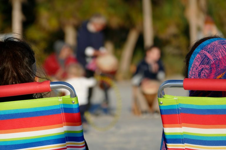 SARASOTA, FLORIDA People sitting on beacj chairs at Siesta Key Beach.